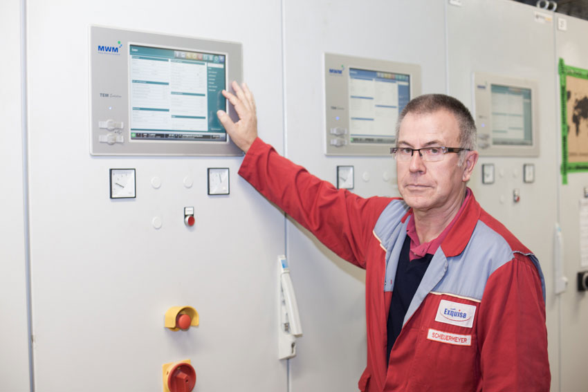 Josef Scheuermeyer, serves as technical director of the Karwendel-Werke for ten years, in front of the CHP control unit