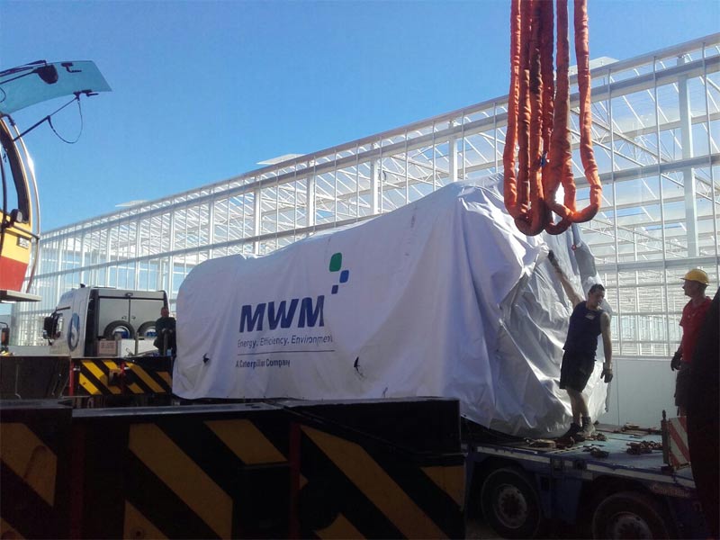 Unloading the MWM TCG 2032 gas engines in front of the shell of the CHP plant